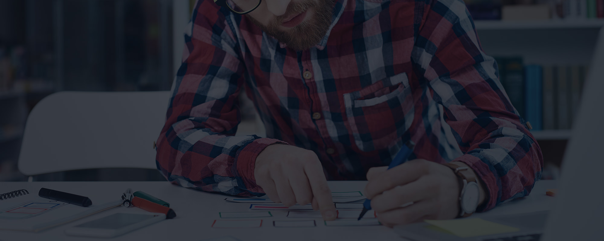 Person Designing on Paper